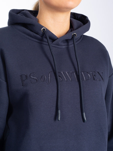 Soft, comfortable hoodie designed with a super smooth inside and drawstrings. The hoodie has a straight boxy fit and is designed with two spacious pockets on both sides, and a text logo embroidery in front.