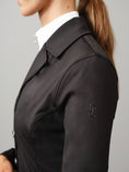 Load image into Gallery viewer, High function, tailored competition blazer made in a technical, stretchy material with a perfect fit. Button closing at the front and a hidden zipper underneath. Pockets at sides with hidden, discreet zippers. Double mesh (non-see through) on the back, sides and under arms for optimal ventilation. Design details such as shiny lining inside peplum and tonal logo on left sleeve.
