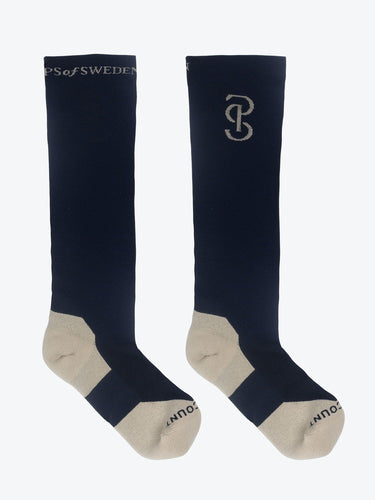 High performance knee-high riding socks in a soft compression pique stitch. Padded comfortable toe and heel reinforcements, with a fine rib in between, and mesh insert at mid-foot. 